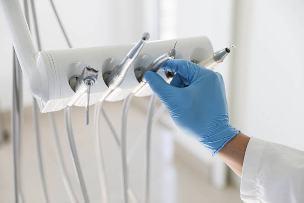 Professional Root Canal Treatment technician working in Brownlee Park, MI